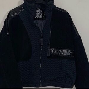 New Balance Women's NB Novelty Heatloft Jacket in black.